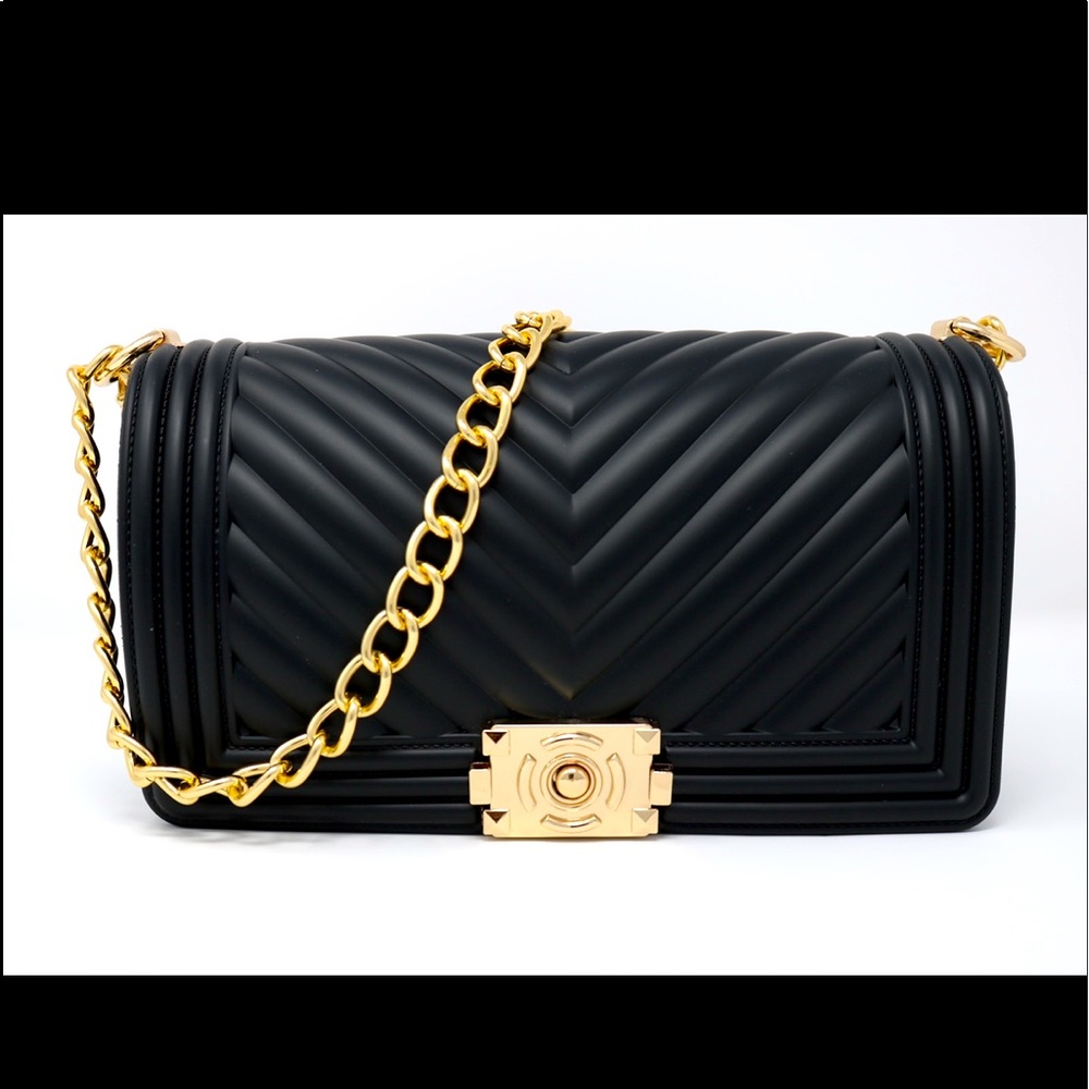 Inspired by luxury brand, boy bag. Excellent quality, durable, & chic.